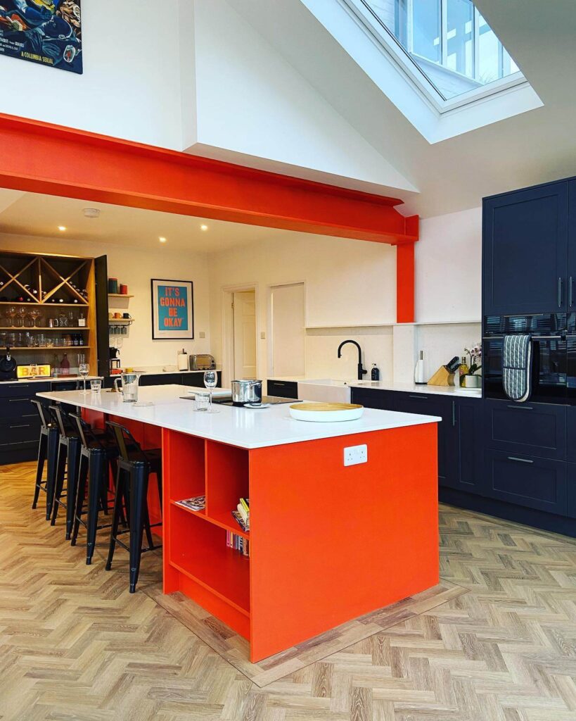 Bold Meets Modern: Orange Island with Navy Accents