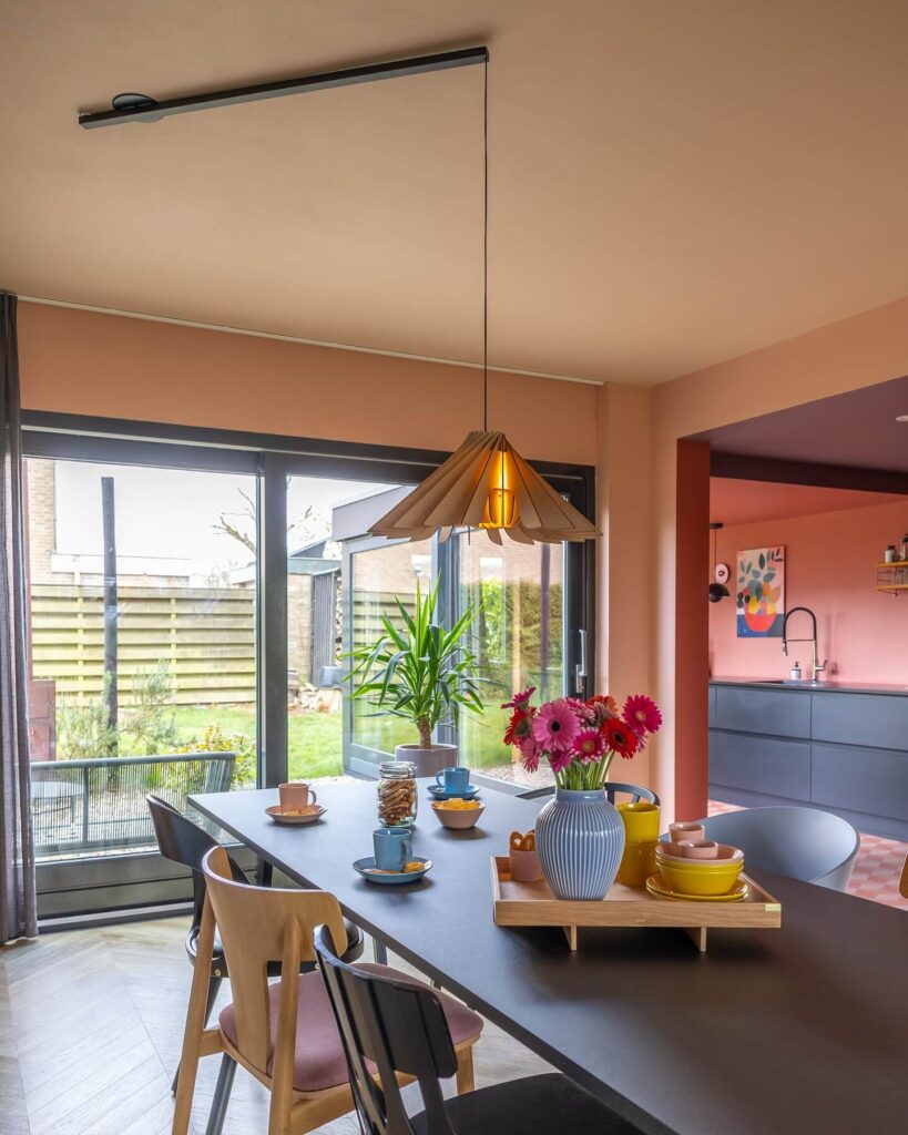 10. Glass-Top Elegance in a Softly Decorated Family Space