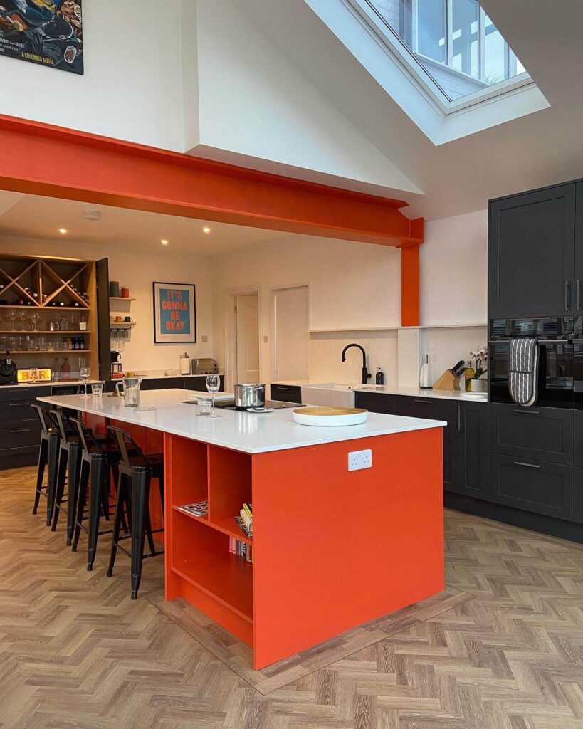 11. Glossy and Bright: High-Shine Orange Cabinets for a Contemporary Look