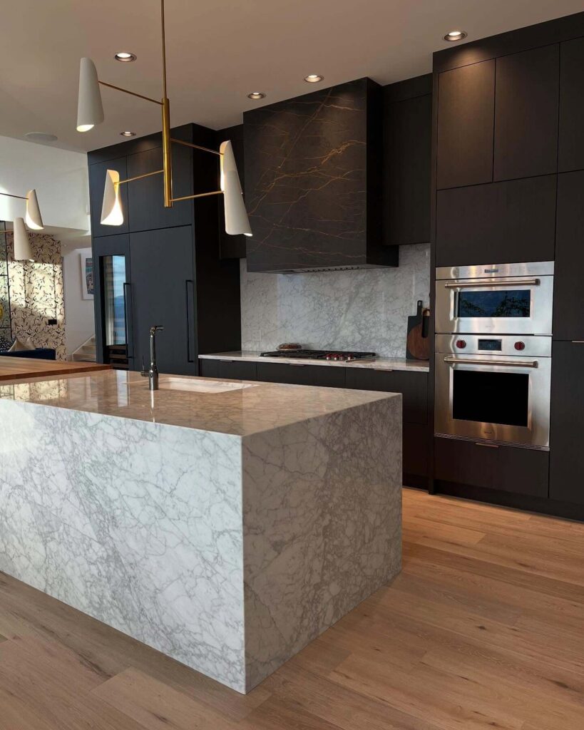 11. Statement Marble in a Black and Oak Kitchen