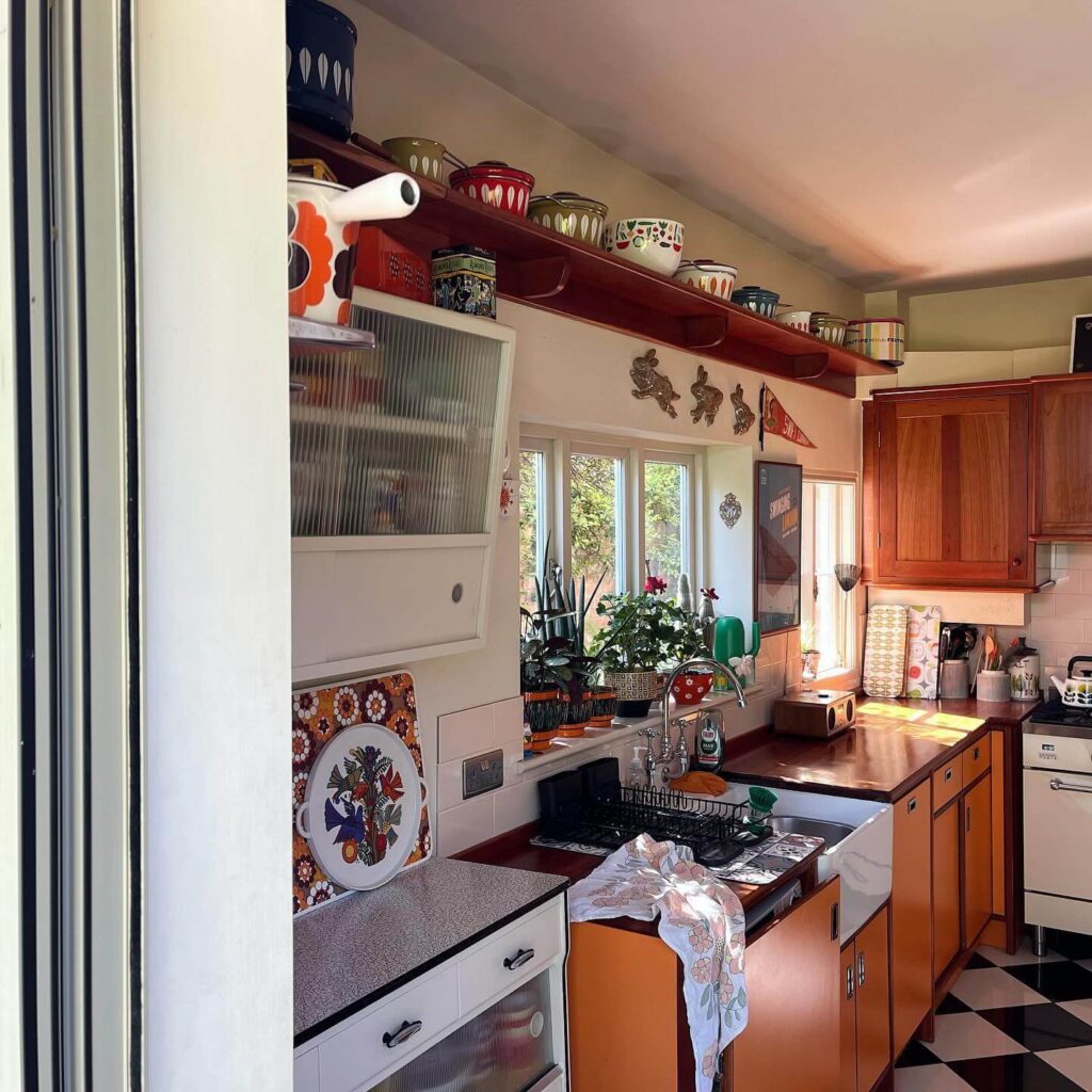 12. Classic Sophistication: Burnt Orange Island in a Light-Filled Space