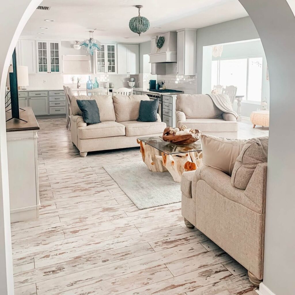 13. Beachy Boho Farmhouse with Washed Woods and Soft Blues