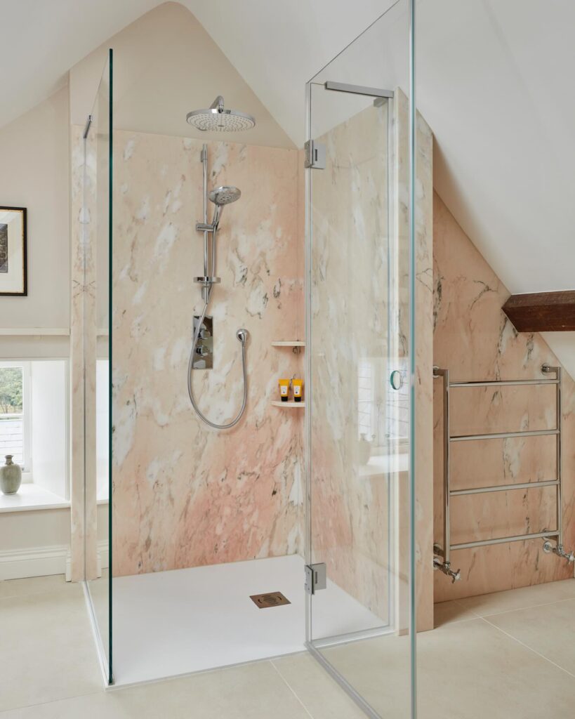 13. Blush Marble Shower for a Soft Statement