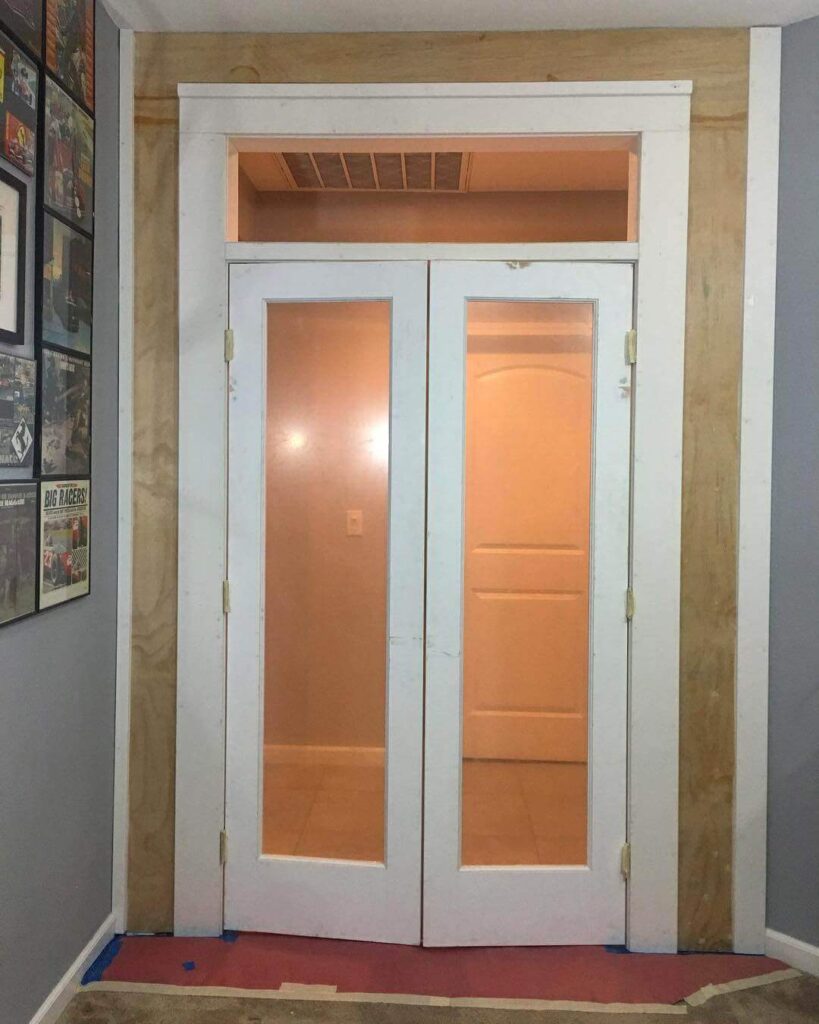 13. Matte Black Sliding Doors with Frosted Panels