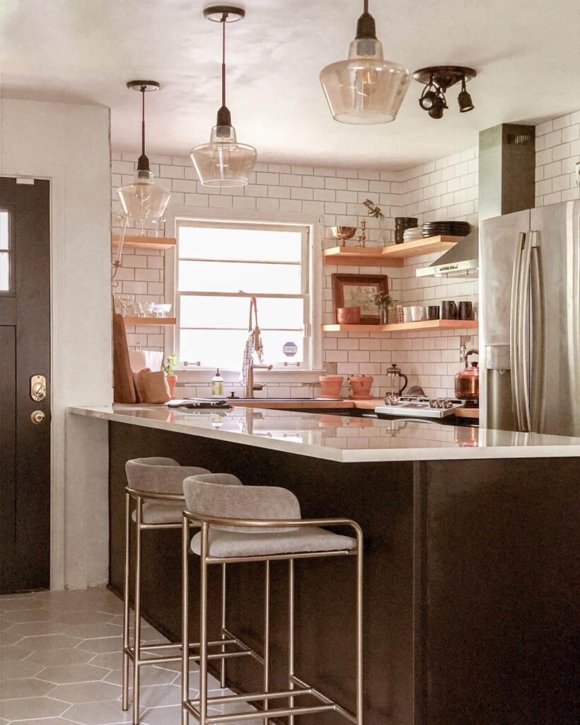 13. Balanced Contrast: Terracotta Flooring and Patterned Tile Backsplash