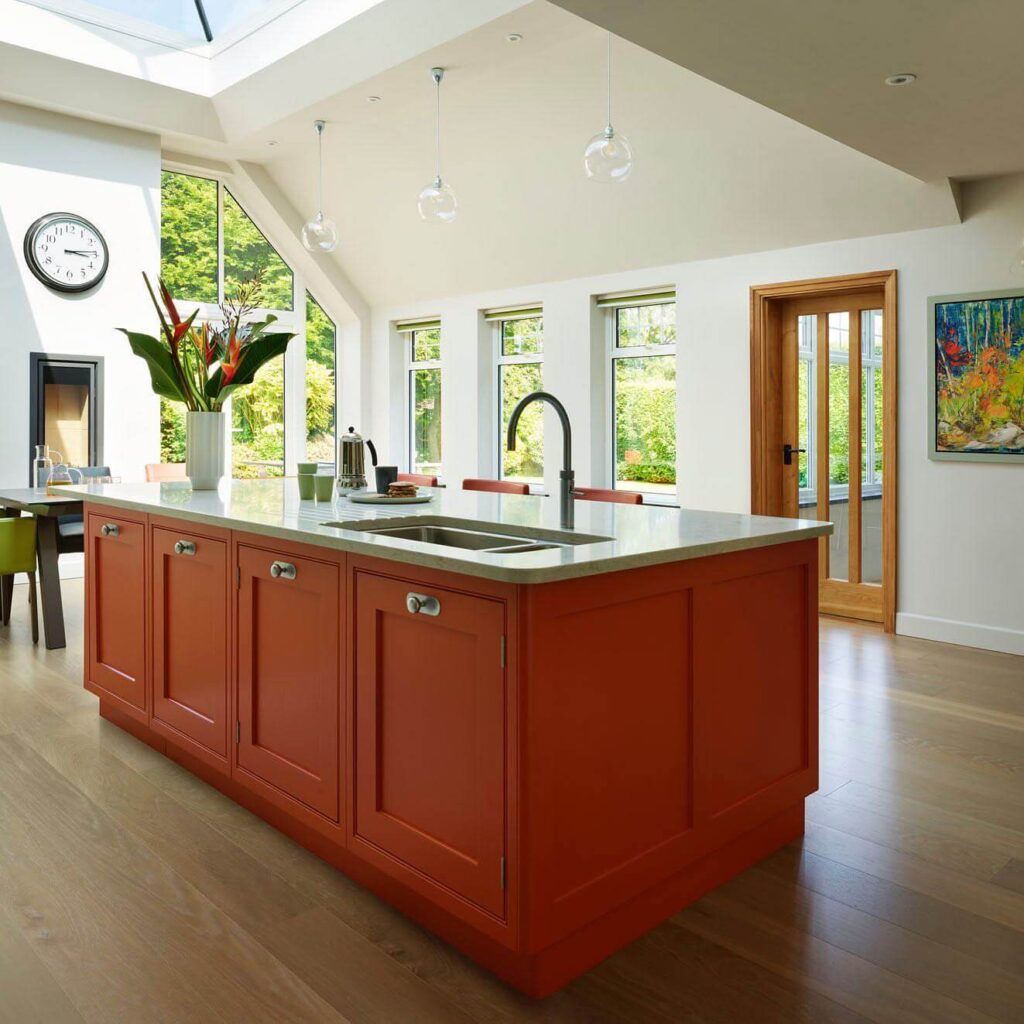 14. Vintage Love: Retro Orange Cabinets with Collectible Charm
