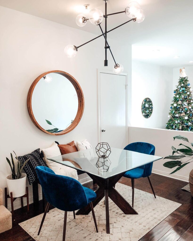 15. Elevate the Room with a Glass Table and Luxe Details