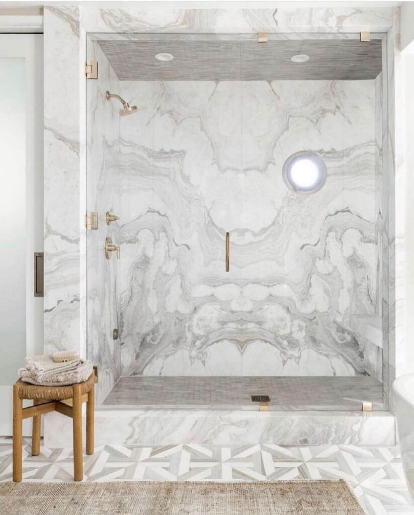 16. Compact Luxury with Built-In Marble Niches