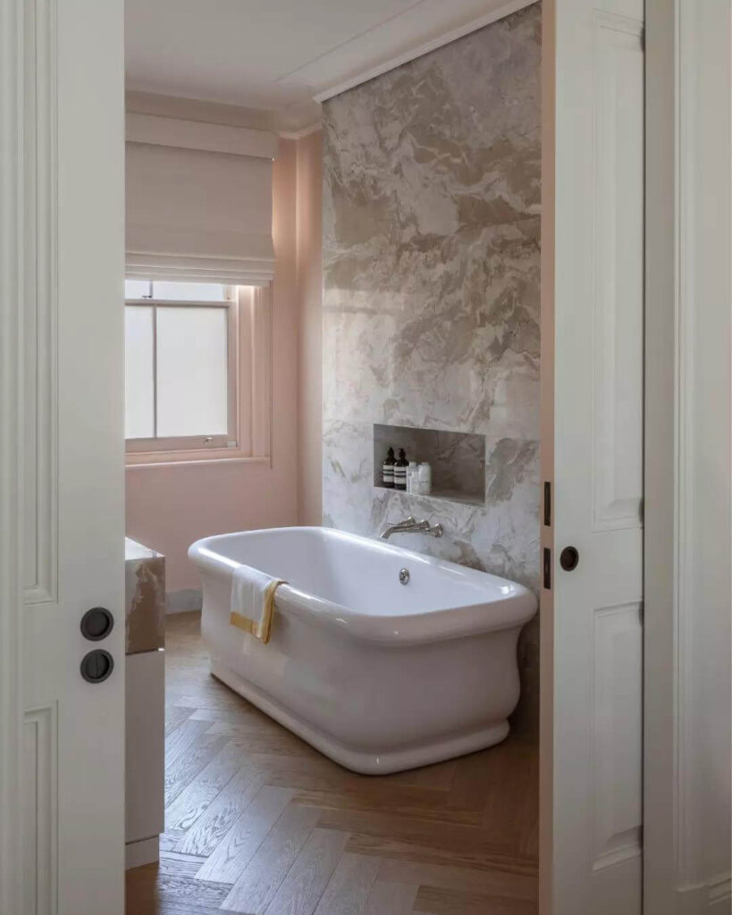 20. Classic Tub Framed by Marble Elegance