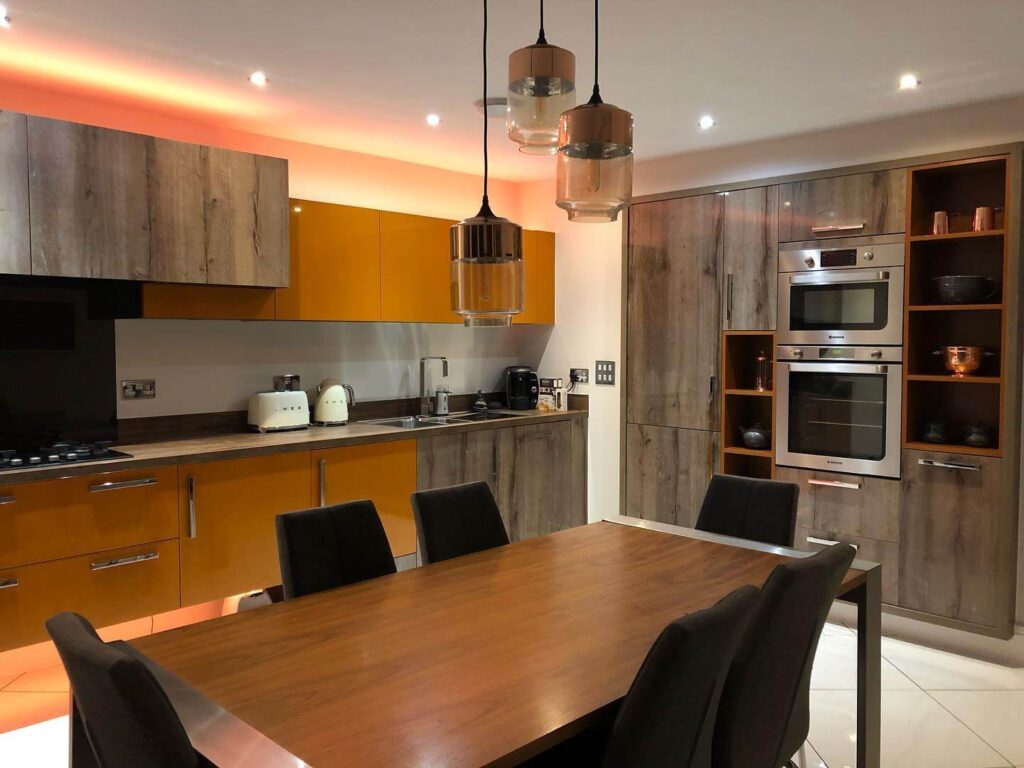 22. Warm & Modern: Honey Orange Cabinets with Rustic Wood Accents