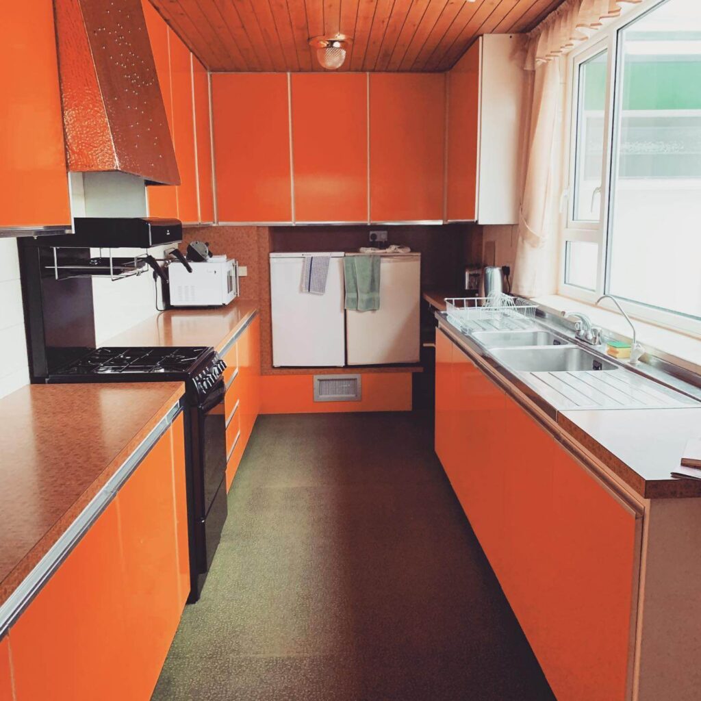 23. Earthy and Eclectic: Subtle Orange with Playful Personality
