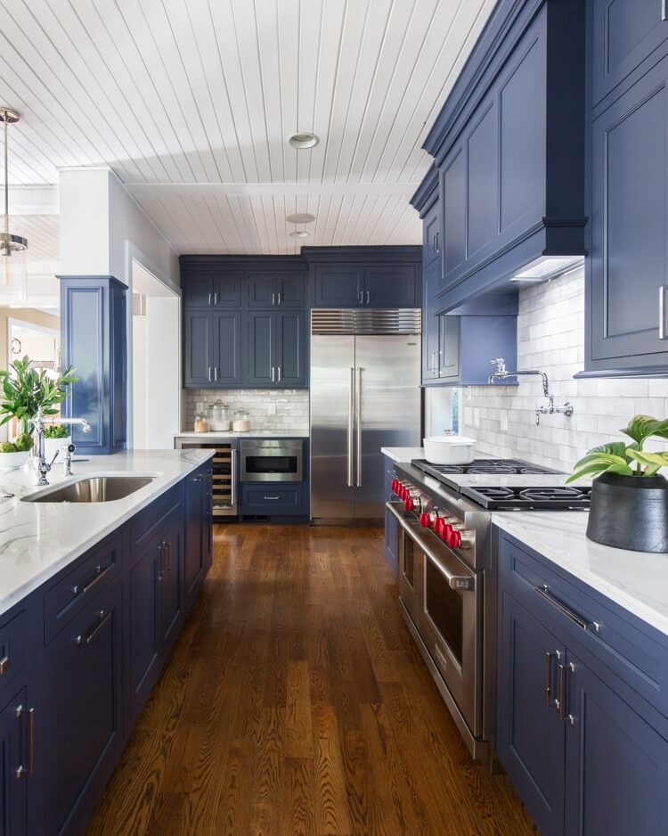 24. Eclectic Boho with Blue Cabinets and Patterned Tile