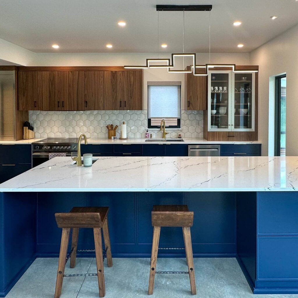 29. Clean Lines and Contrast with Black Countertops