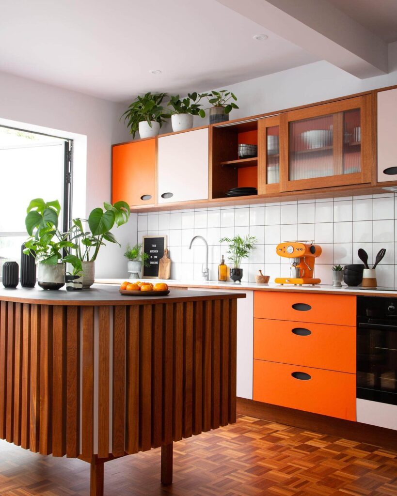 3. Mid-Century Meets Modern: Pops of Orange with Natural Wood