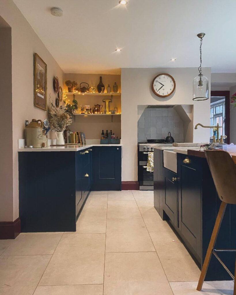3. Cozy Eclectic Vibe with Dark Blue Base Cabinets