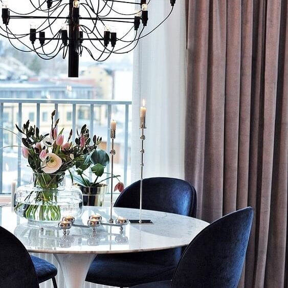 4. Sleek and Moody: Velvet Chairs in Deep Blue Hues