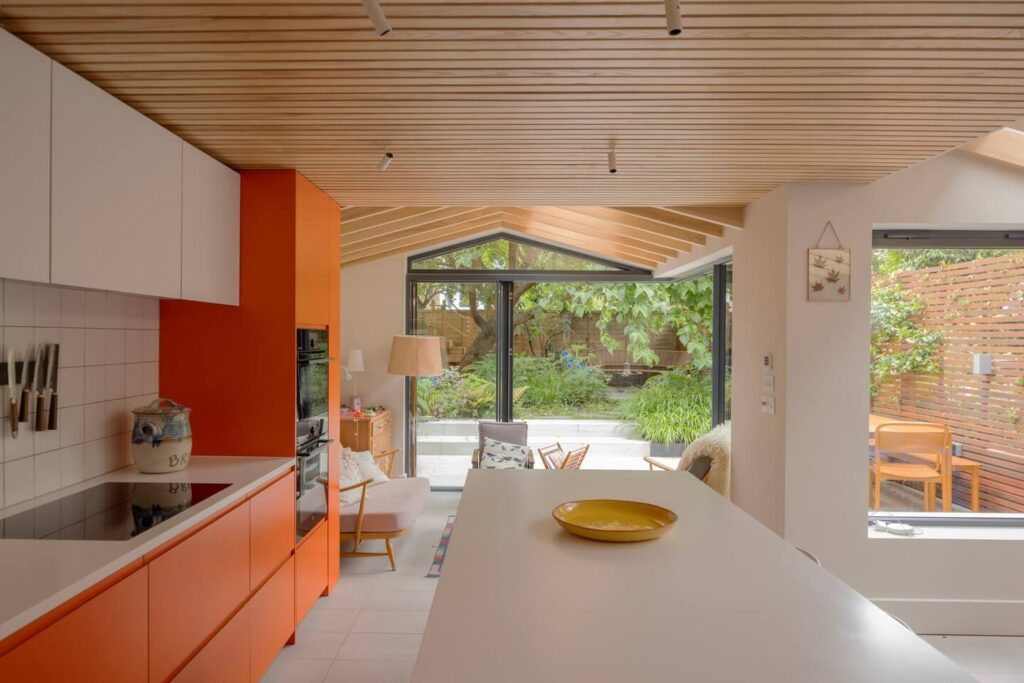 Seamless Indoor-Outdoor Living with a Splash of Orange