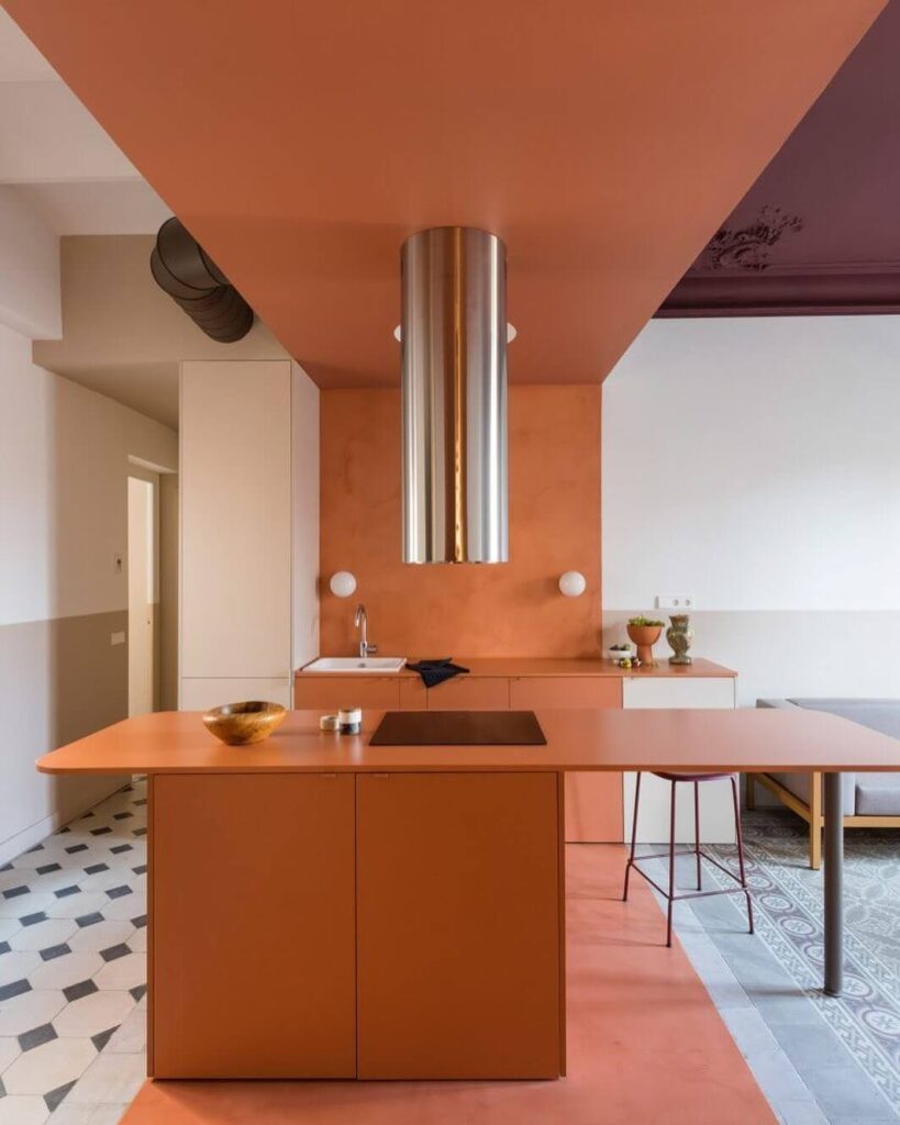 6. Rustic Elegance: Deep Orange Meets Antique Accents