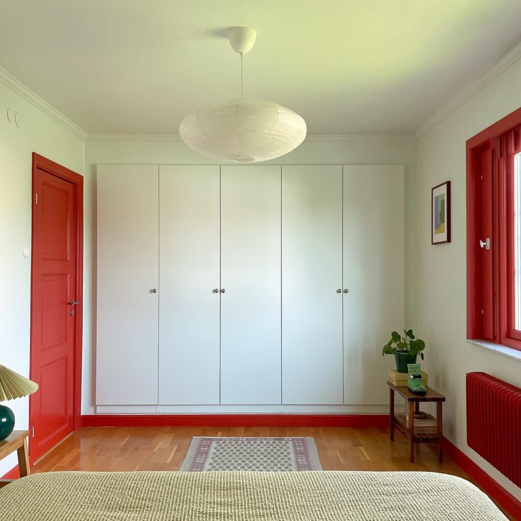 6. Minimalist IKEA Wardrobe with a Bold Pop of Color