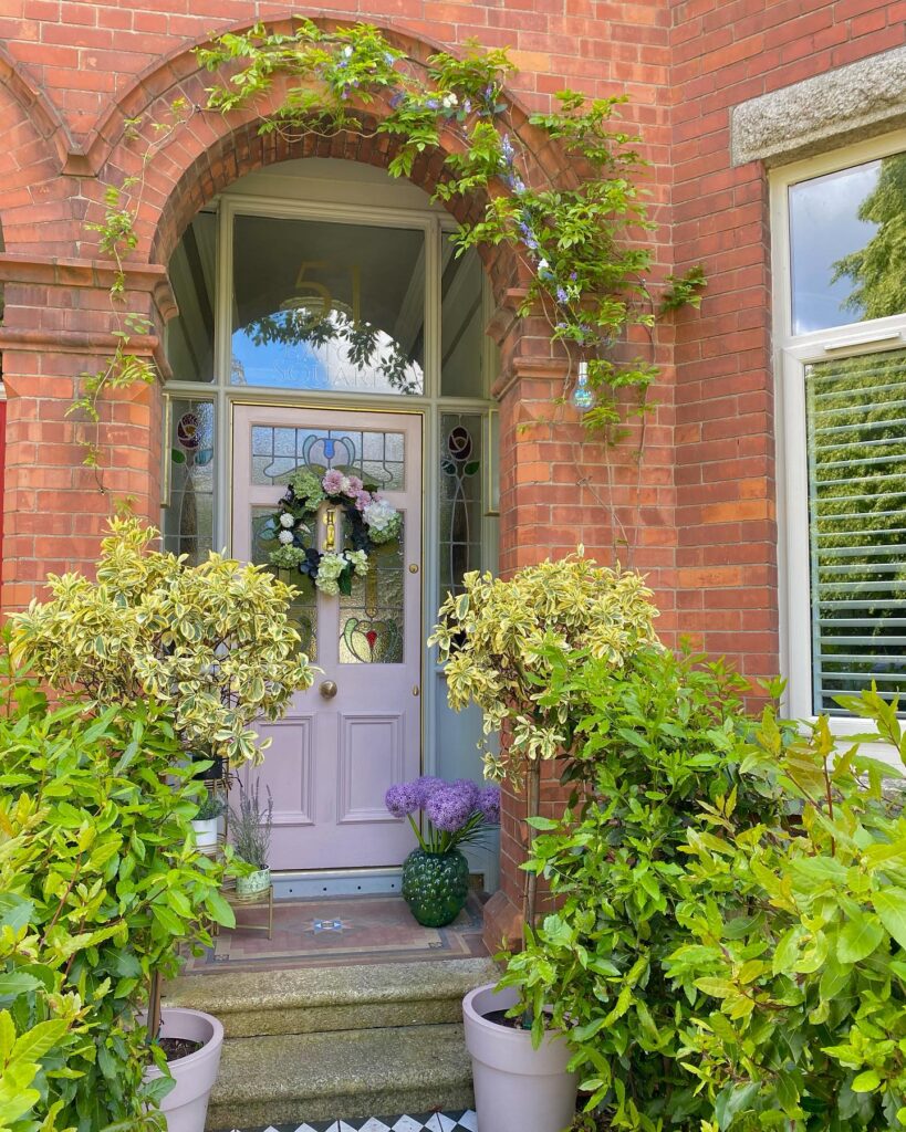 14. Arched Wooden Door with Mediterranean Influence