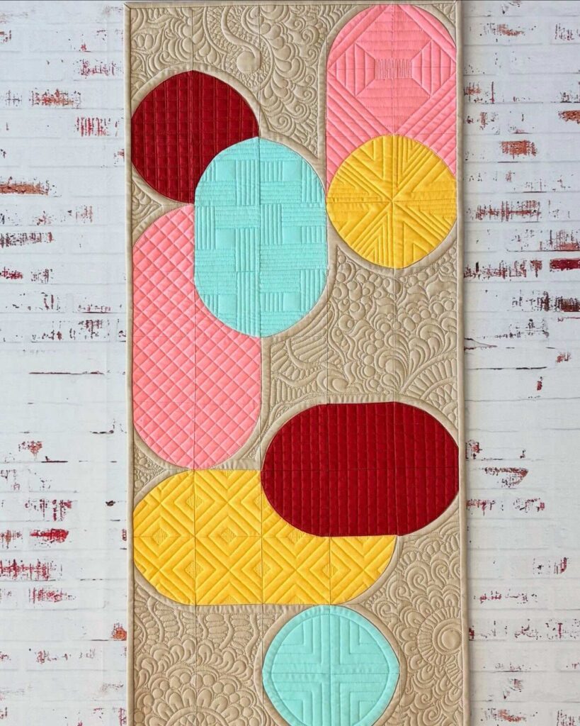 14. Quilted Wall Art That Pops with Pattern