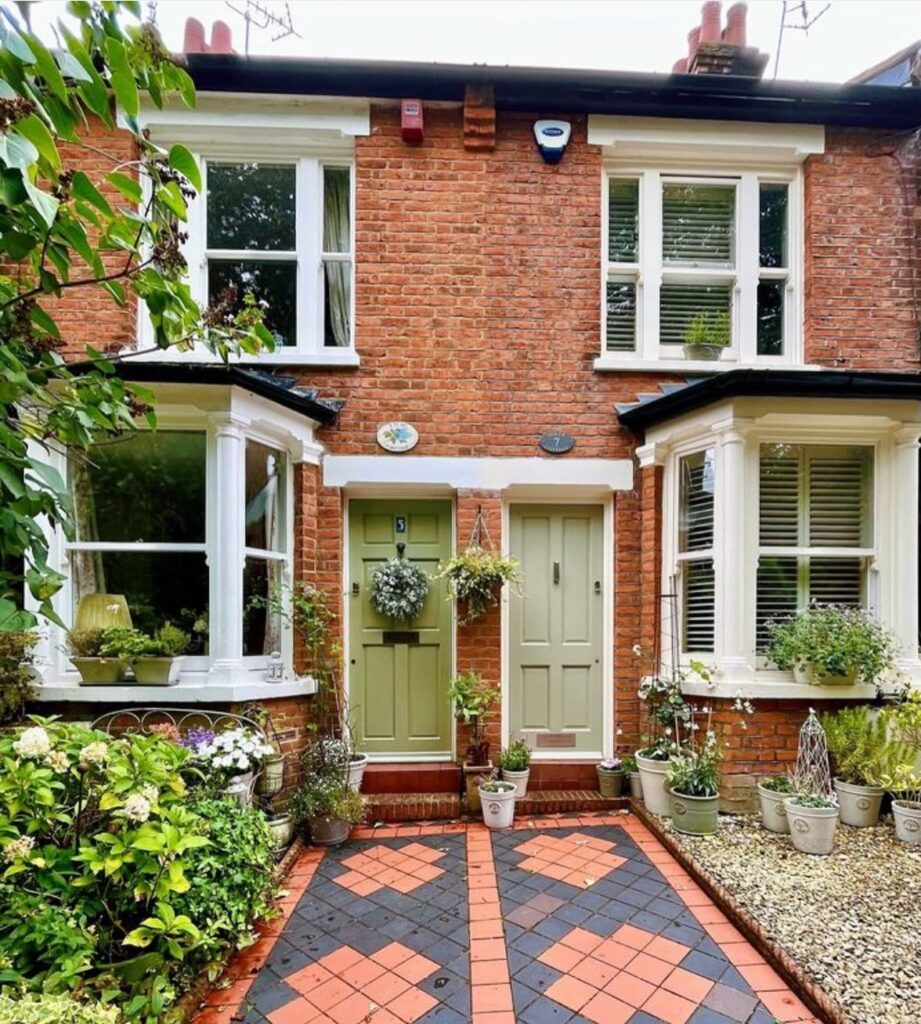 17. Vibrant Coral Door for Tropical Personality