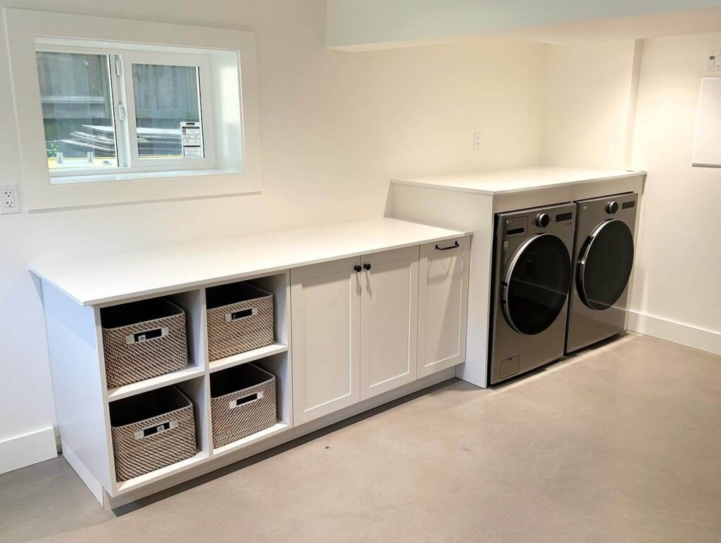 17. Spacious and Modern Laundry Zone with Built-In Cabinets