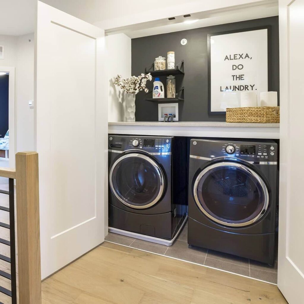 19. Neutral Laundry Closet with Textured Backsplash and Warm Accents