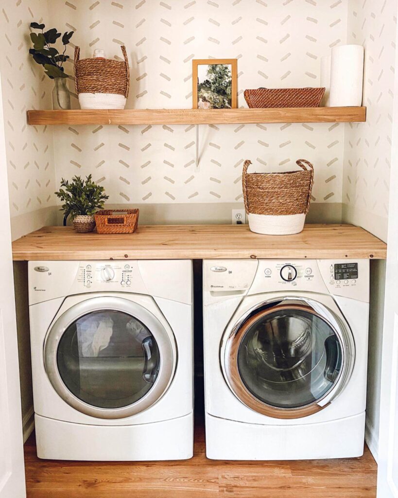 2. Closet Laundry Setup with Bold Wallpaper and Industrial Lighting