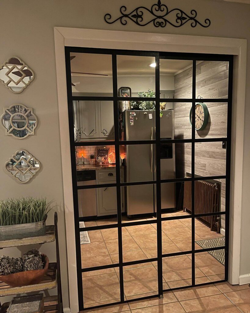 23. Frameless Sliding Mirror Doors for Sleek Simplicity