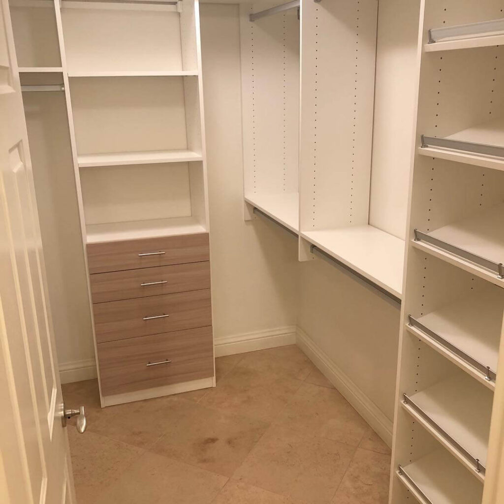 3. Narrow Closet with a Sleek, Dark Finish