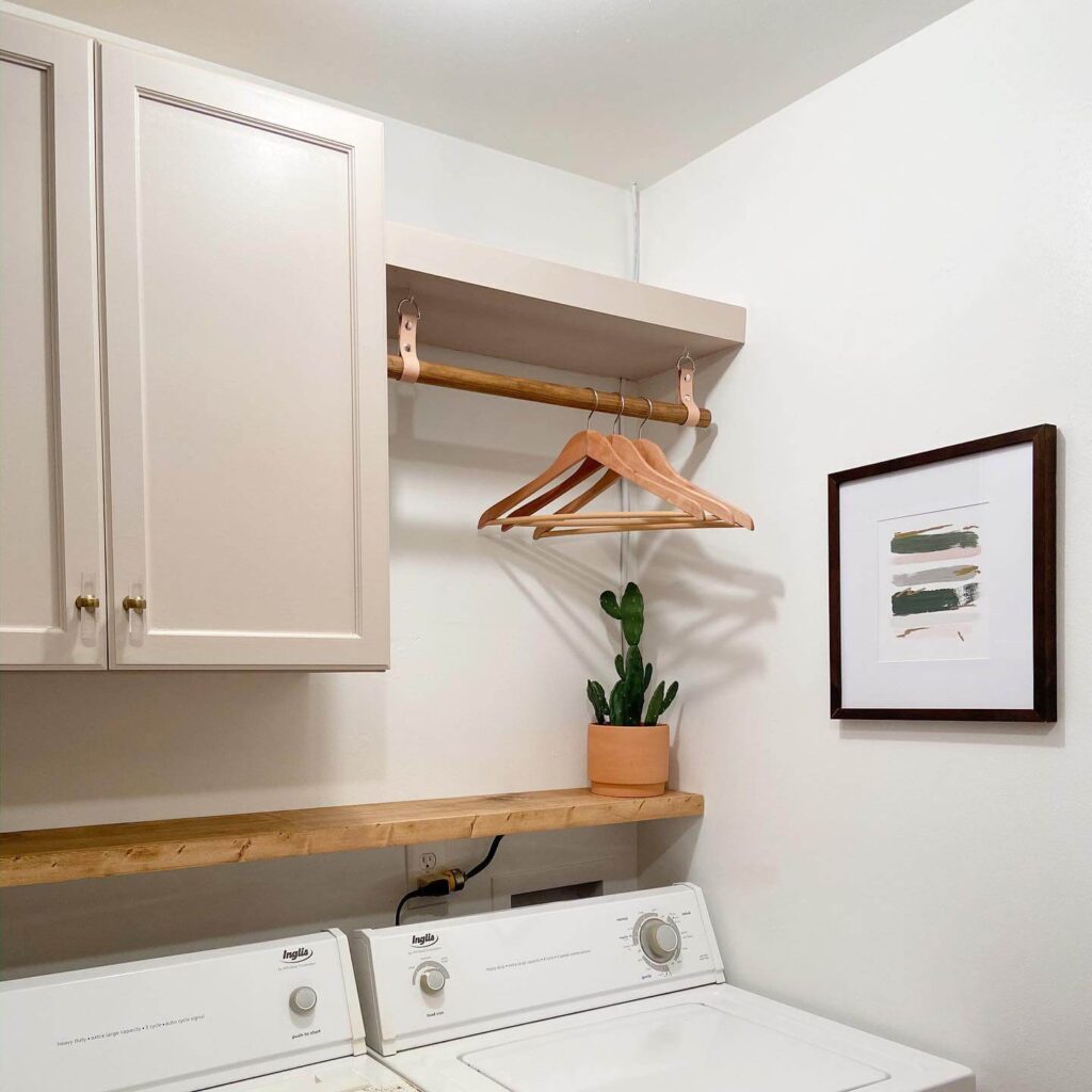 4. Retro-Inspired Laundry Corner with Graphic Wallpaper