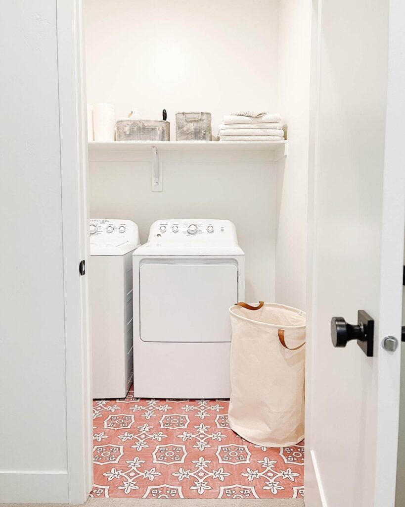 5. Compact Laundry Closet with Statement Tile Flooring