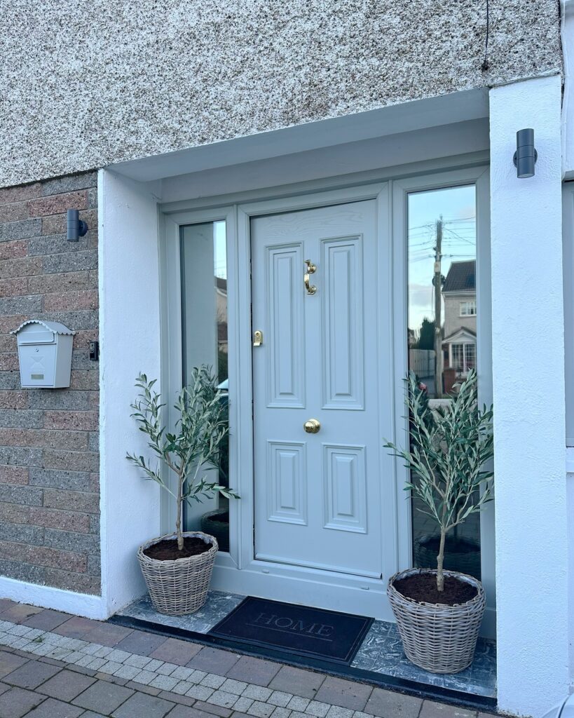 5. Double Doors with Arched Glass for Timeless Grandeur