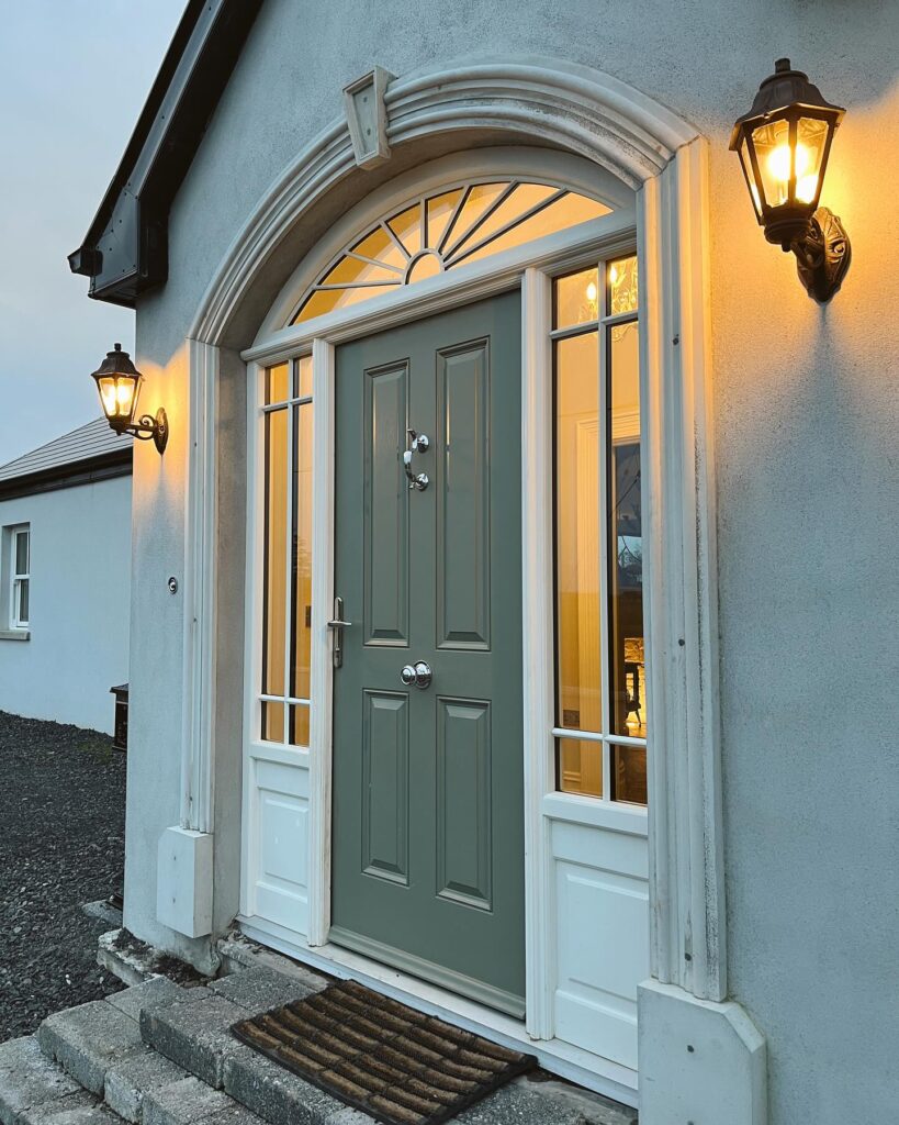 6. Classic White Paneled Door with Wreath Decor