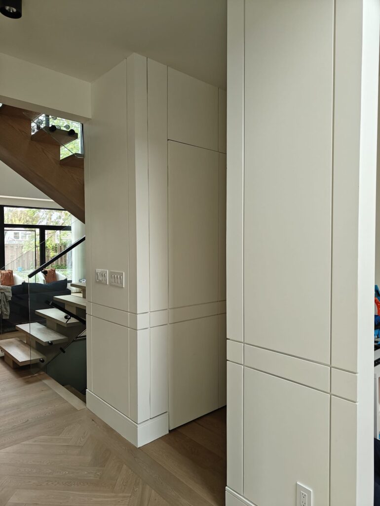 6. Elevated Entryways with Tall Wall Paneling