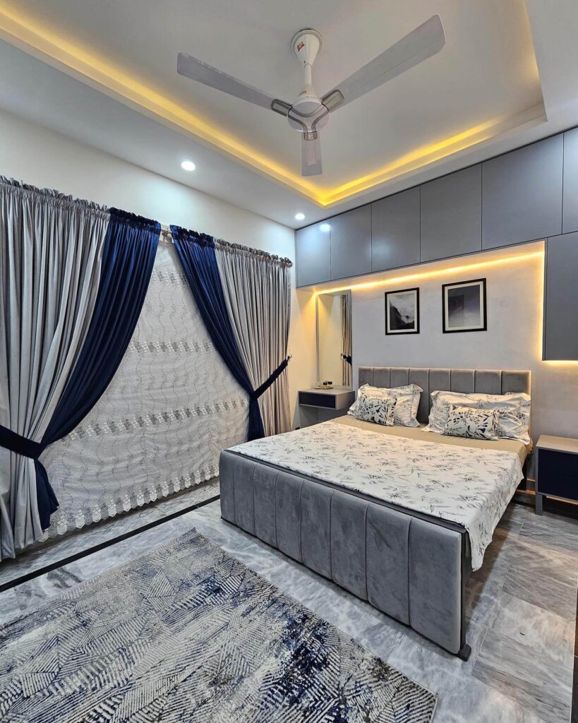 7. Sleek Backlit Paneling for a Contemporary Bedroom