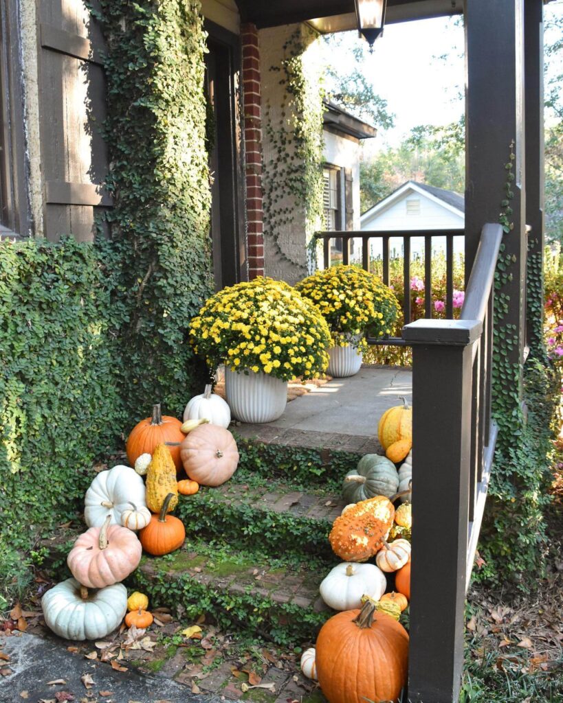 2. Bold Black Door with Harvest-Inspired Accents