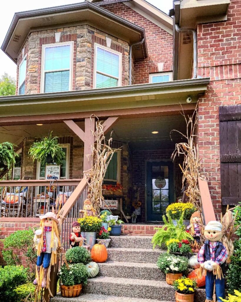 24. Coordinated Porch Decor That Matches the Front Door